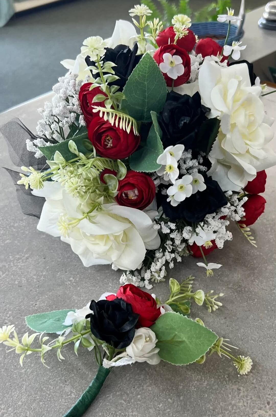 Wedding bouquet and boutonniere in red, white and black